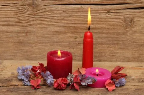 Three red candles Stock Photos