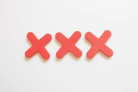 Three red crosses on a white background. Symbols for a game, marking, selecti 스톡 사진