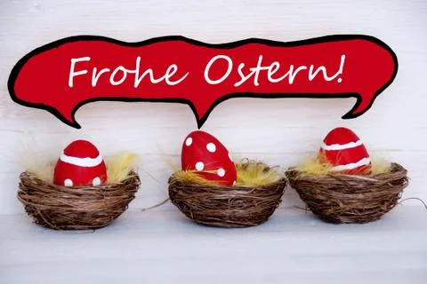 Three red easter eggs with comic speech balloon frohe ostern means happy east Foto stock