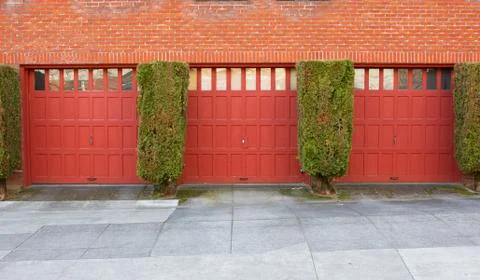 Three red garages Stock Photos