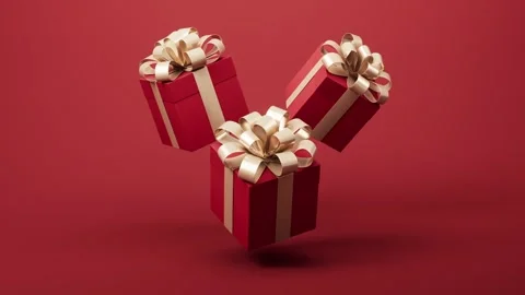 Three red gift boxes with golden ribbons floating on red background with su.. 스톡 동영상 327109769