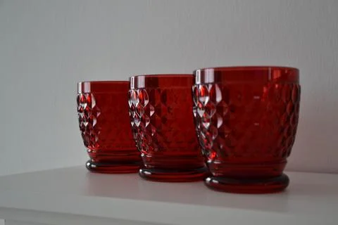 Three red glasses on the table Foto stock