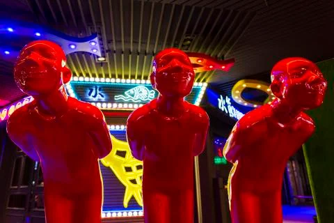 Three Red Men Statue Photos