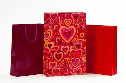 Three red packet with hearts on a white background Stock Photos