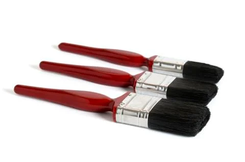 Three red paint brushes Stock Photos