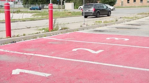 Three red parking spots spaces with numbers 1 2 3 in each of them side by side Stock Footage 249752723
