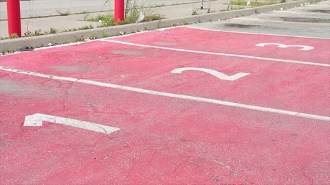 Three red parking spots spaces with numbers 1 2 3 in each of them side by side Stock Footage 249752778
