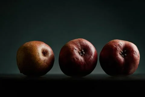 Three red pears on a black table Stock Photos