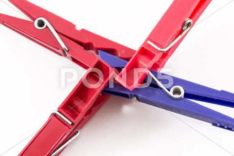 Three Red Pegs Attacking Blue Peg Stock Photos