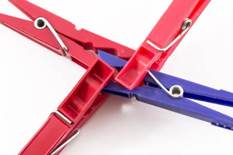 Three Red Pegs Attacking Blue Peg Stock Photos