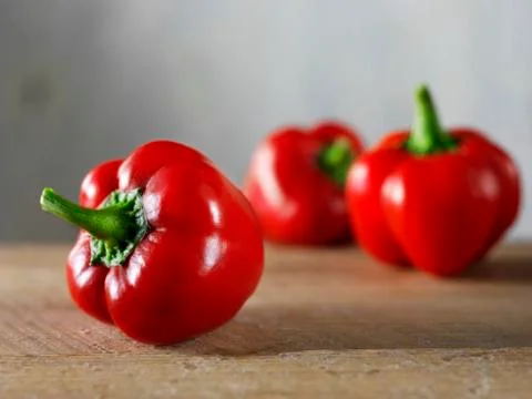 Three red peppers Stock Photos