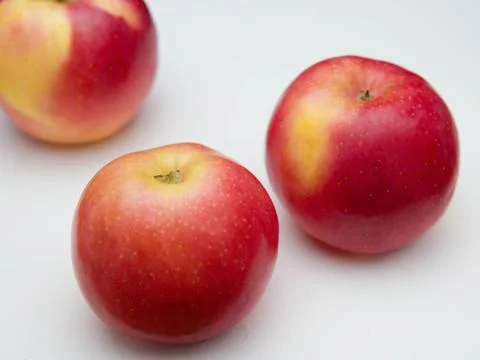 Three red ripe juicy apples Stock Photos