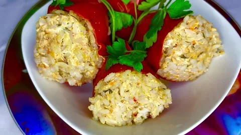 Three red stuffed bell peppers on a plate. Stock Footage 305194719