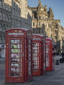 Three red Telephone Boxes in row on the Royal Mile. Stock Photos