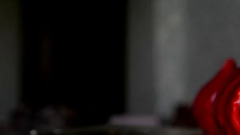 Three red their mousse cake with mirror glaze and gold sequins swirl on the base Stock Footage 76122866