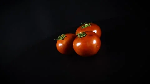 Three red tomatoes Stock-Footage 154427593