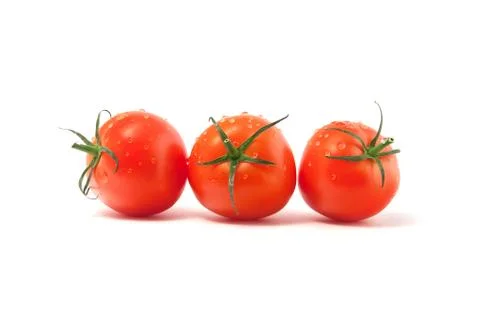 Three red tomatoes isolated on a white background Stock Photos