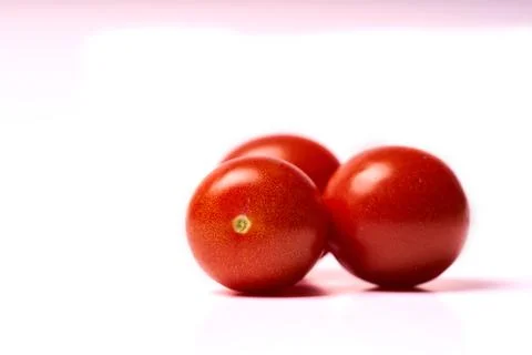 Three red tomatoes isolated on white background Stock Photos