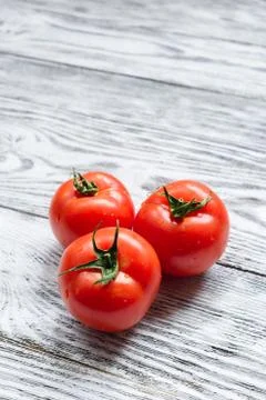 Three red tomatoes Stock Photos