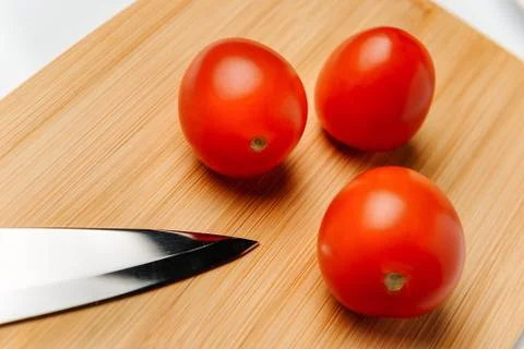 Three red tomatoes Stock Photos