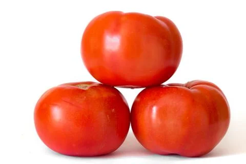 Three red tomatoes in a pile isolated on white background Stock Photos