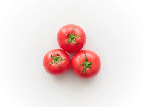 Three red tomatoes. Top view Foto stock