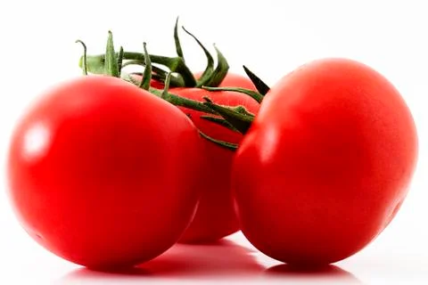 Three red tomatos Stock Photos