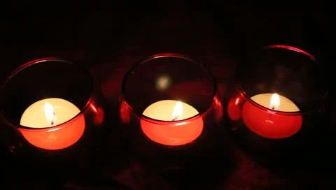 Three red votive candles Stock Footage 11019587