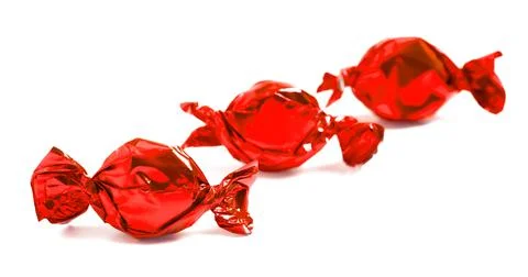 Three Red Wrapped Candy Isolated on a White Background Stock Photos