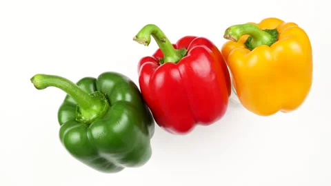 Three Red Yellow Green Bell Peppers Rotating On White Background Stock Footage 325563307