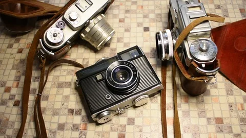 Three retro cameras, two rangefinders, one compact Stock Footage 122562933