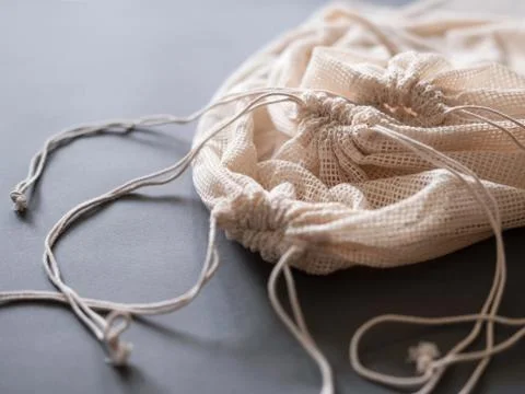 Three reusable string bags for different products, closeup. Stock Photos