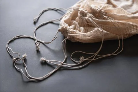 Three reusable string bags for various products, closeup. Stock Photos