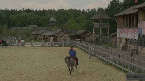 Three Riders Are Turning, Man on a Gray Horse is The Last, Ancient City, Slow Stock Footage 52234873