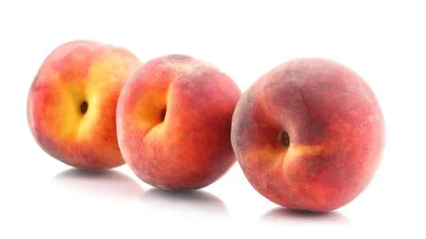 Three ripe peach on a white background Stock Photos