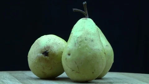 Three ripe pears on the wooden desk 動画素材 79727449
