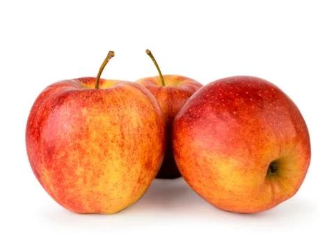 Three ripe red apples close up on a white. Isolated. Stock Photos