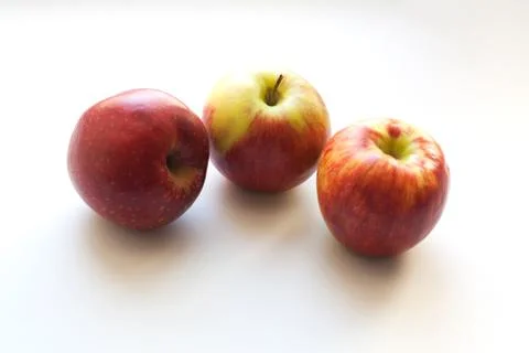 Three ripe red apples Stock Photos