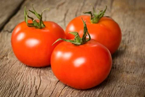 Three ripe tomatoes Stock Photos