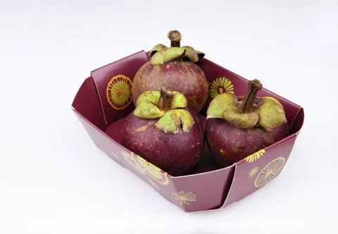 Three ripen mangosteens Stock Photos