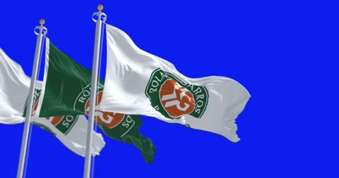 Three Roland Garros flags waving isolated on a blue background Stock Footage 241603542