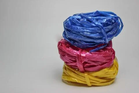 Three rolls of colorful raffia rope isolated on white background. 写真素材