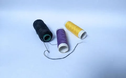 Three rolls of threads with different color Stock Photos