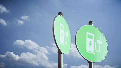Three rotating electric vehicle charging signs on poles against sky, modern 3D Stock Footage 336318393