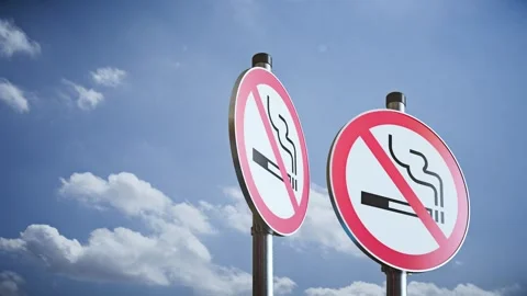 Three rotating no smoking signs on poles against sky, modern 3D prohibition Stock Footage 336317455