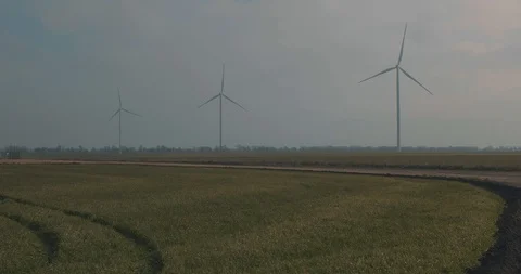 Three Rotating Wind Generators Against The Sky. The Strength Of The Wind Stock Footage 123712602