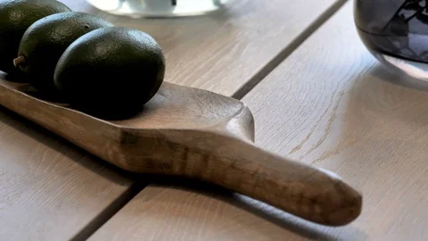Three round objects on top of the wooden spatula Stock Footage 116660569