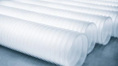 Three rows of white plastic cups are stacked on top of each other. The cups a Stock Photos