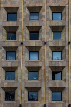Three rows of windows in the building. Stock Photos