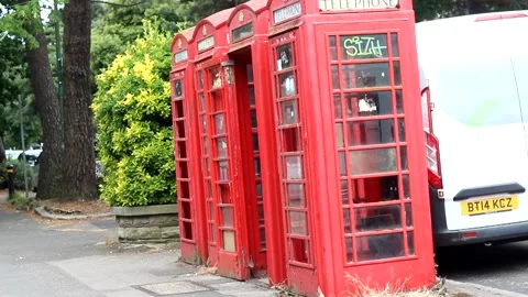 Three run down old red post boxes with graffiti Stock Footage 277362617